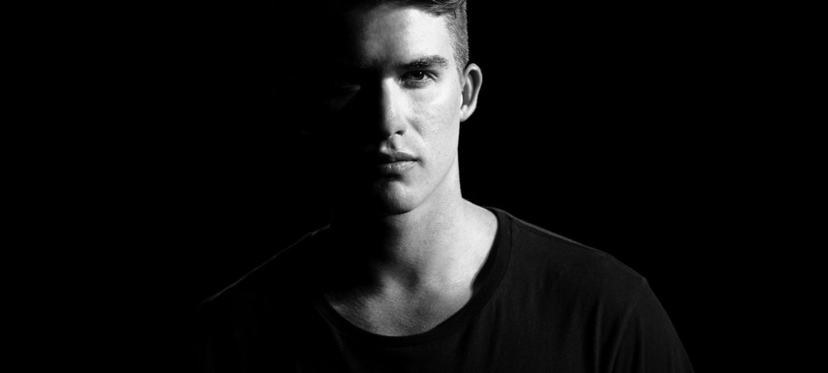 grayscale photography of man wearing shirt