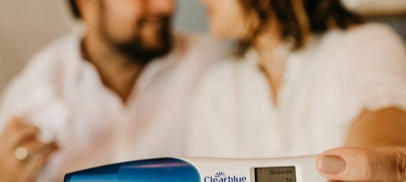 Photo by Jonathan Borba man in white dress shirt holding blue and white digital thermometer