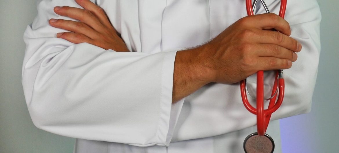 Photo by Online Marketing doctor holding red stethoscope
