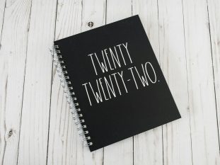 a notebook with the words twenty twenty two written on it